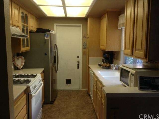 Kitchen with maple cabinets, Corian countertops an