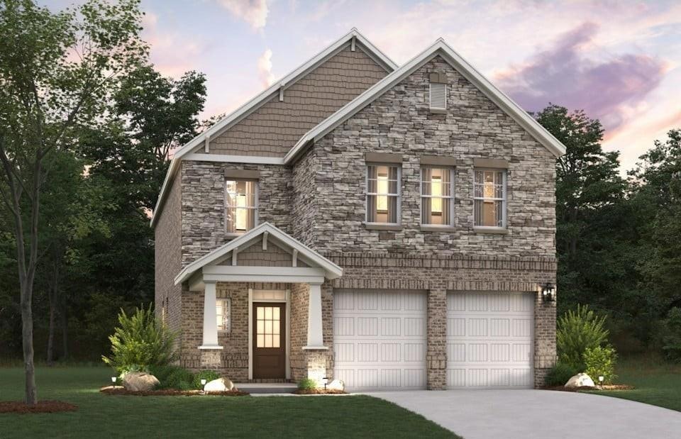 Craftsman-style home with a garage and a yard