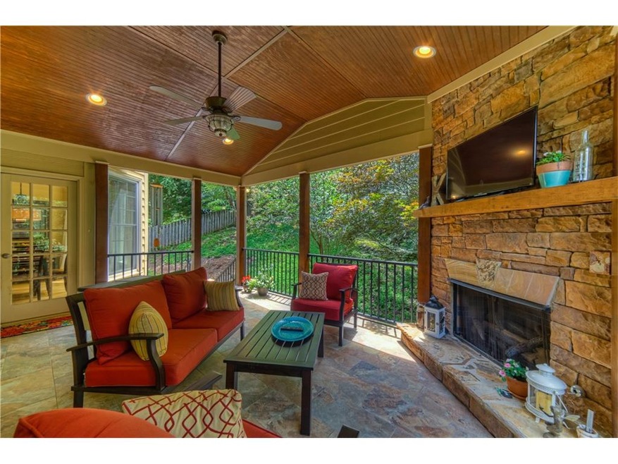 Fabulous covered porch with stacked stone fireplac
