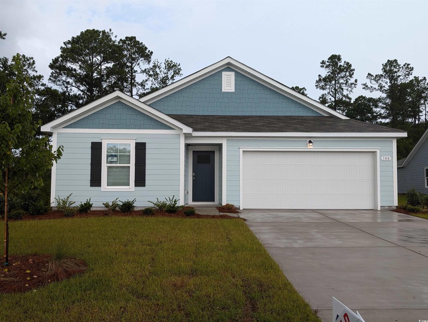 View of front of property with a garage and a fron