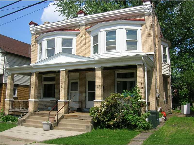 Exterior Front. Solid brick construction with off 