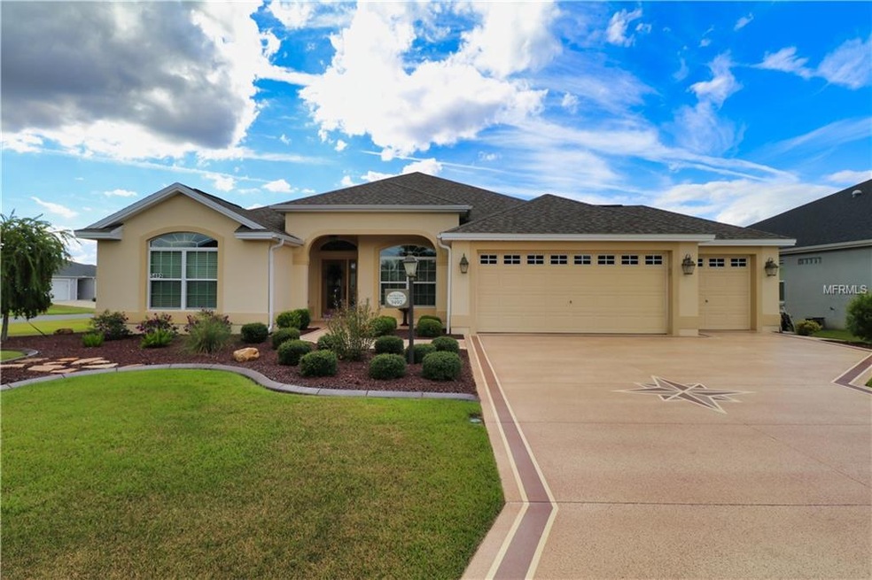 Located on a corner lot, home features golf cart g