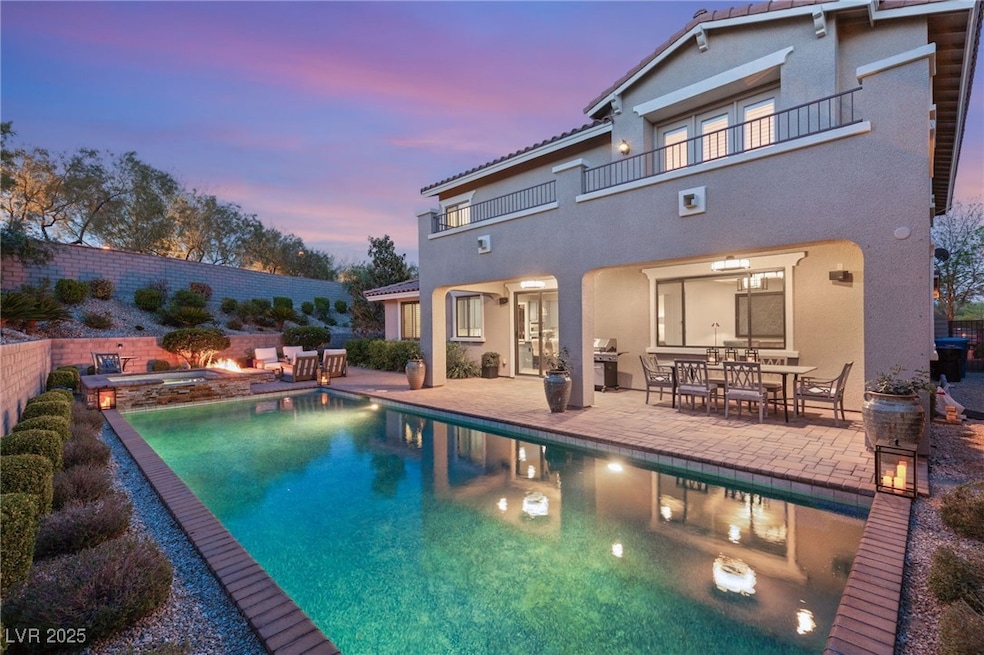 Pool, spa and firepit adjacent to covered patio.