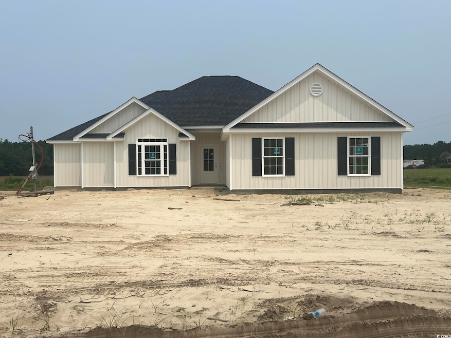 View of front of house featuring a shingled roof
