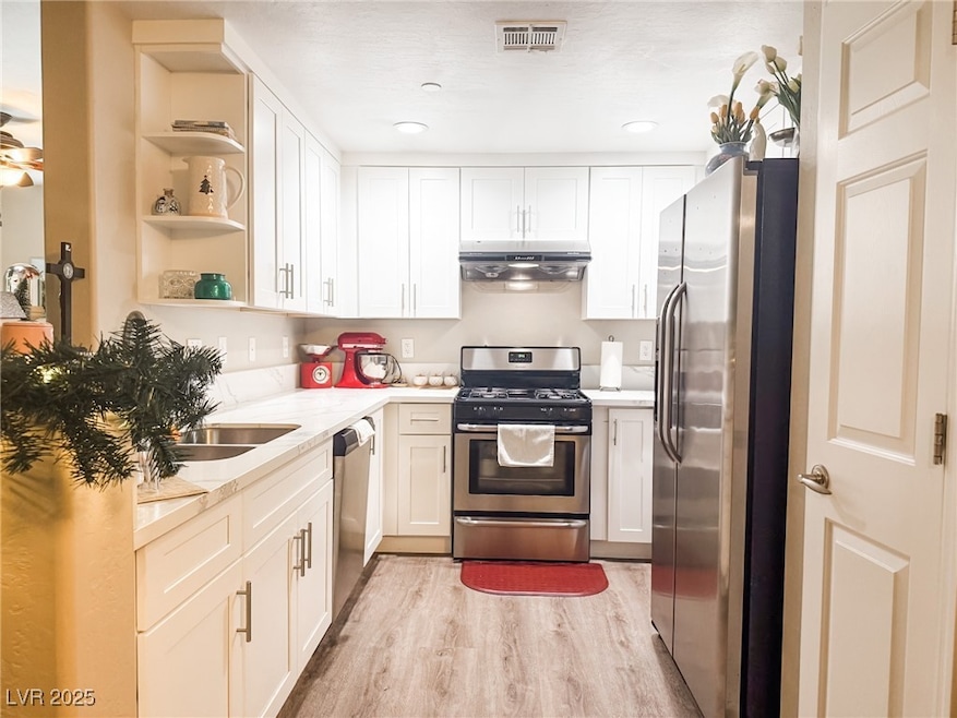 Kitchen featuring appliances with stainless steel