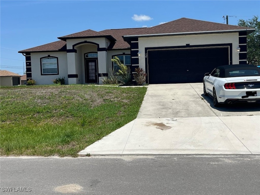 View of front of property featuring stucco siding,
