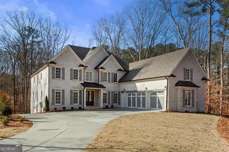 View of front facade featuring a garage