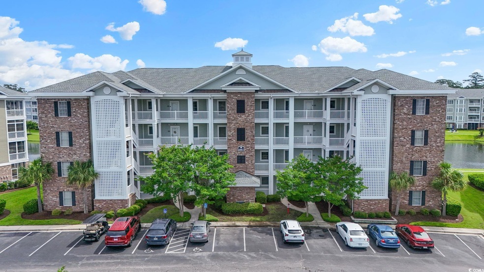 View of property with uncovered parking