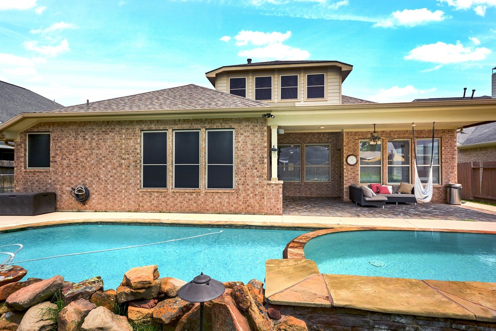 Welcome to this FABULOUS home in Firethorne with EVERYTHING you are looking for.  1 1/2 stories, with all bedrooms down, a study, formal dining, sunroom, huge game room, 3 1/2 baths, oversized garage, POOL and HUGE spa!