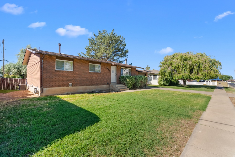 Ranch-style home featuring brick siding