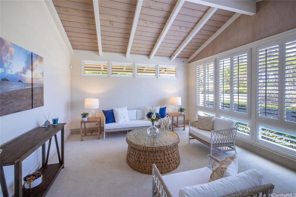 Front living area offers vaulted ceilings, plantat