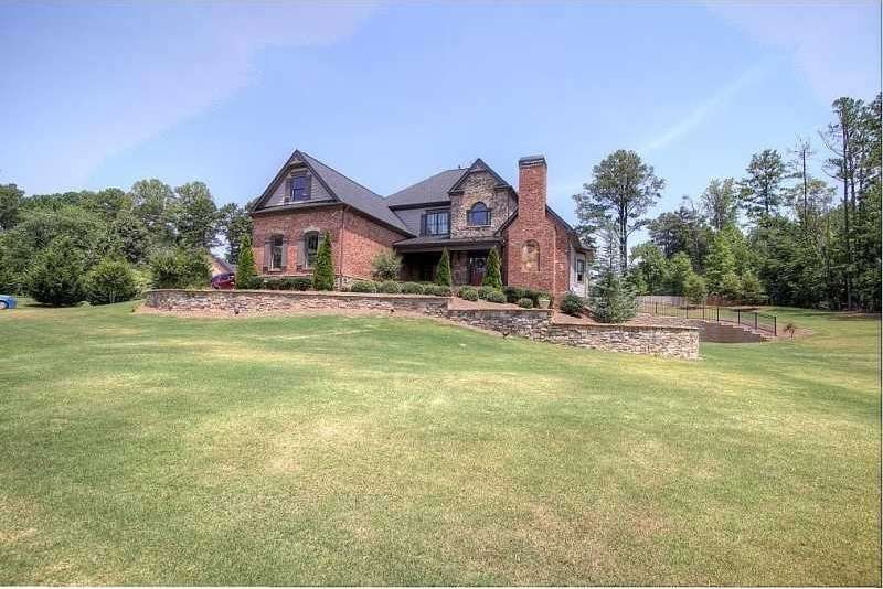 Exterior Front. Beautiful 3 side brick home on lar