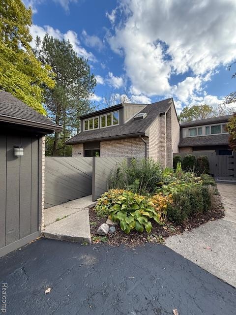 View of front of property with brick siding
