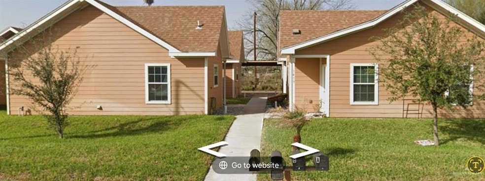 View of front of property with a front yard