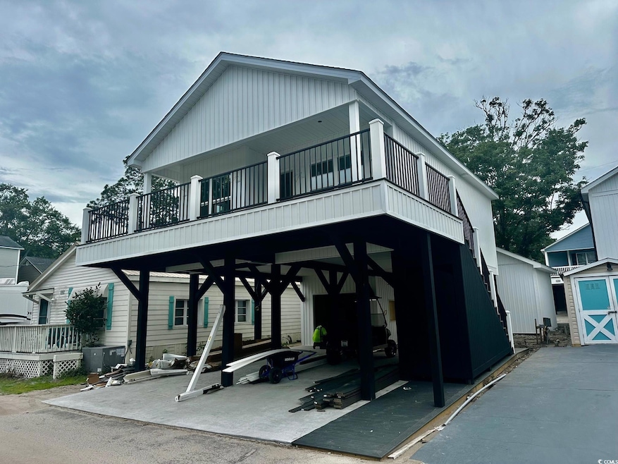 View of front of property with a balcony