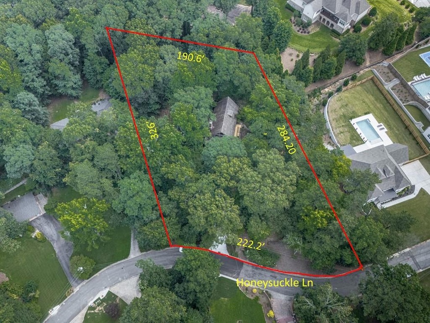 Aerial view of property and surrounding area with property boundaries highlighted