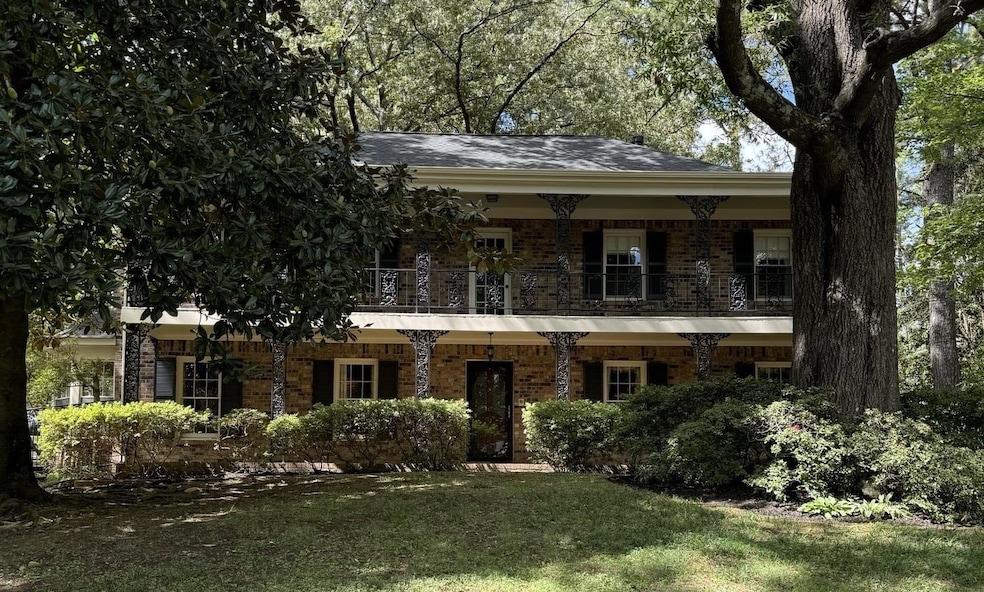 View of front of house with a balcony and a front 