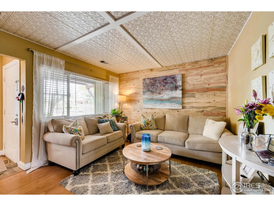 Living Room with tin ceiling & beetle kill wall
