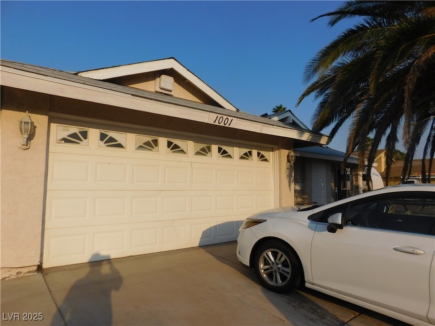 Garage featuring driveway