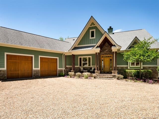 Welcome to 213 Overlook Point Road! Main level over-sized garage and pea gravel motor courtyard create an estate like home.