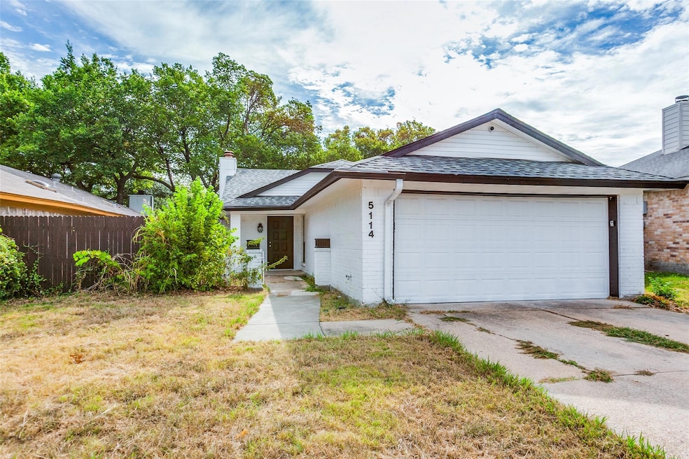 Ranch-style house with a garage and a front yard