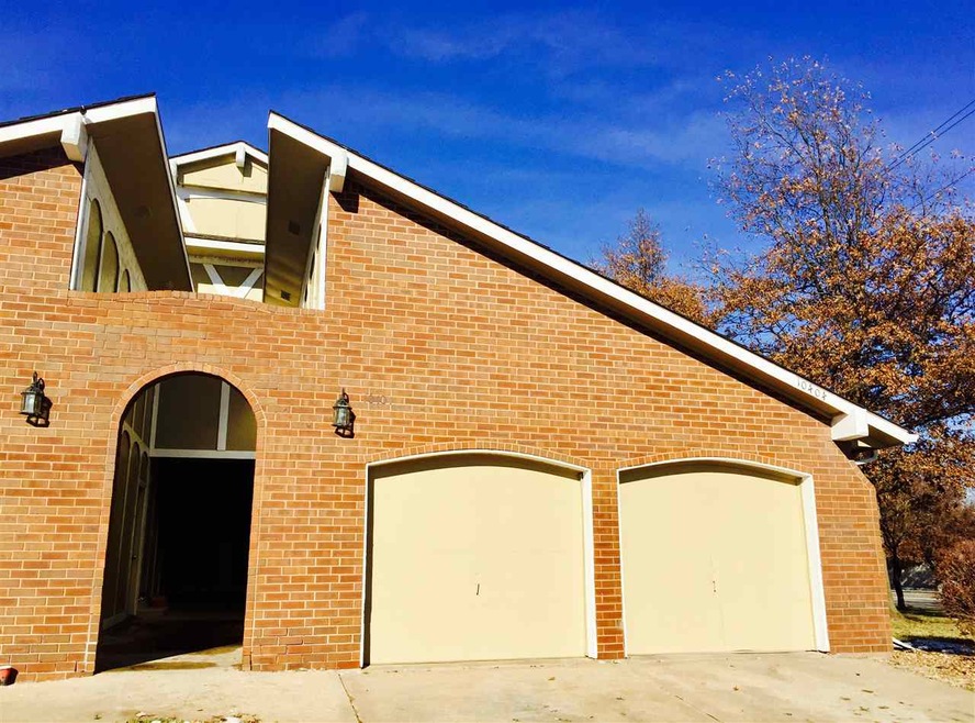 Front entrance to condo, garage pictured on left s