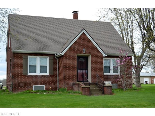 Charming brick bungalow on a beautiful 1/2 acre lot overlooking private farmland.
