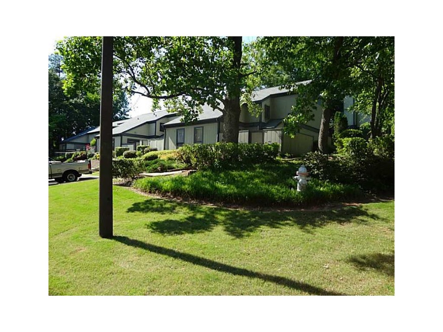 Exterior Front. Hidden jewel with lush, mature lan
