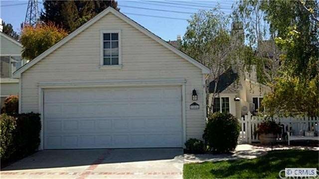 Front View.  Two car garage with long driveway.  D