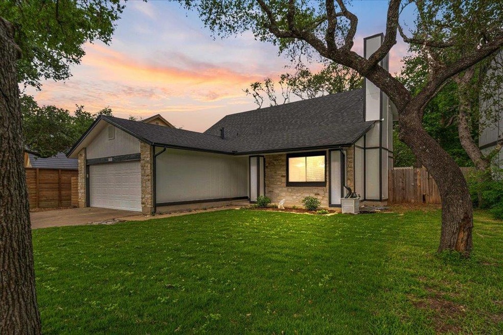 View of front of home with a front lawn, a shingl