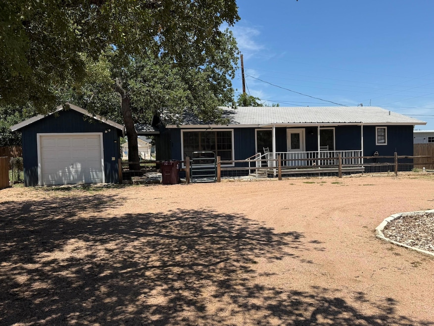 View of front of house featuring an outbuilding, 