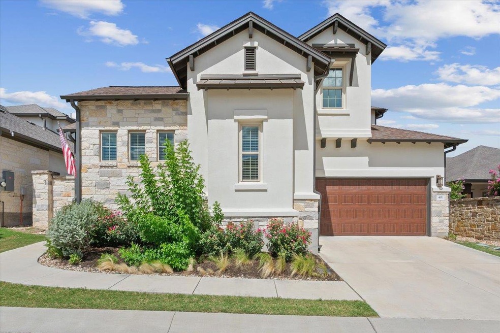 View of front of house featuring stone siding, st