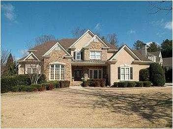 Exterior Front. Lovely stone and hardcoat stucco h
