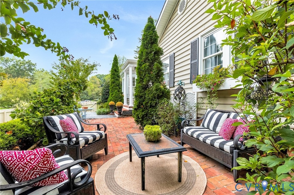 View of front brick patio featuring outdoor lounge area