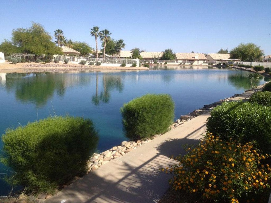 view of lake with walking path