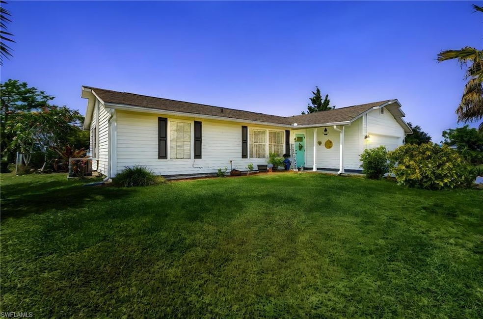 Ranch-style home featuring a front yard