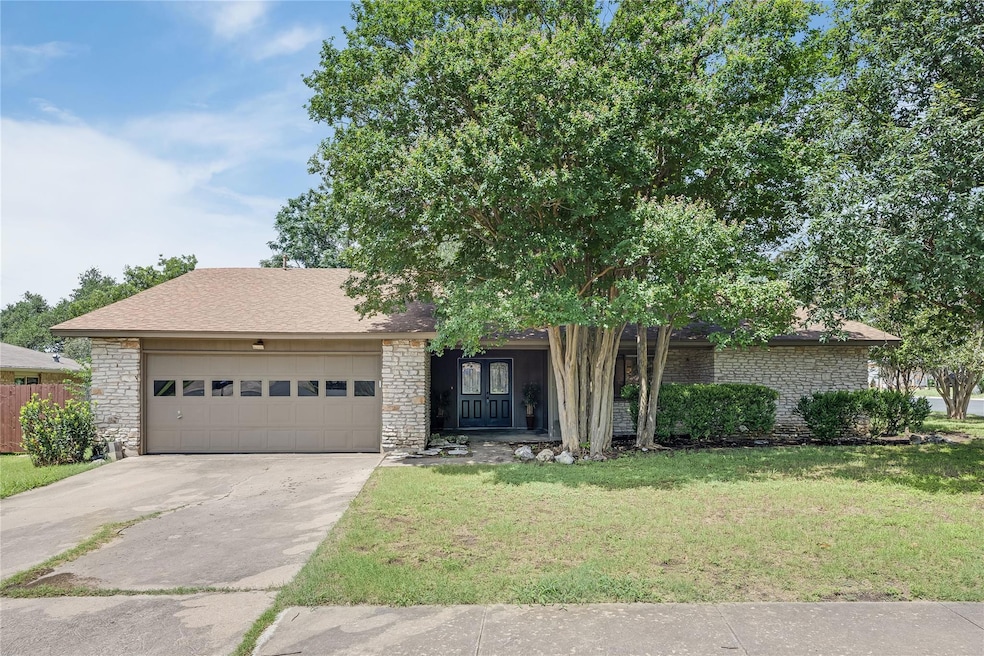 View of front of property featuring an attached g