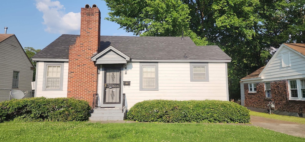 Bungalow-style home featuring a front lawn, a chimney, and a shingled roof