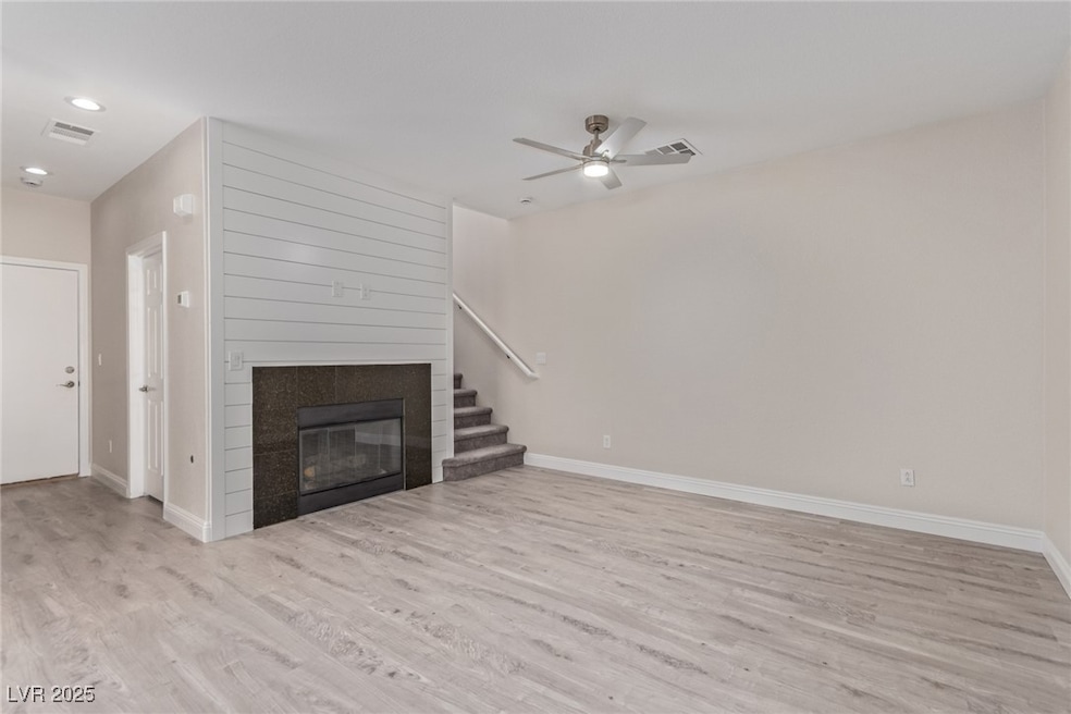 Unfurnished living room with light wood finished f