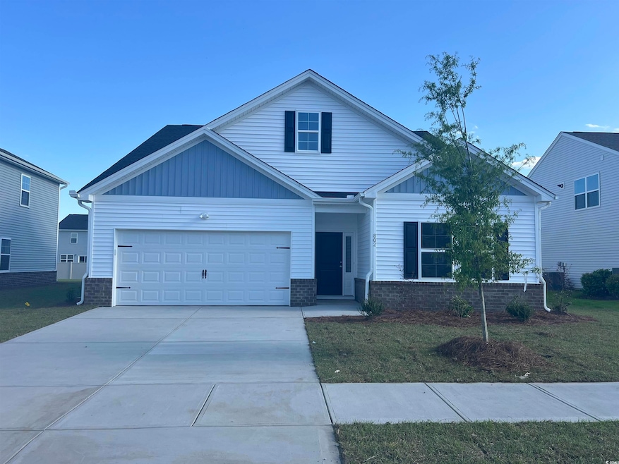 View of front facade featuring concrete driveway, 