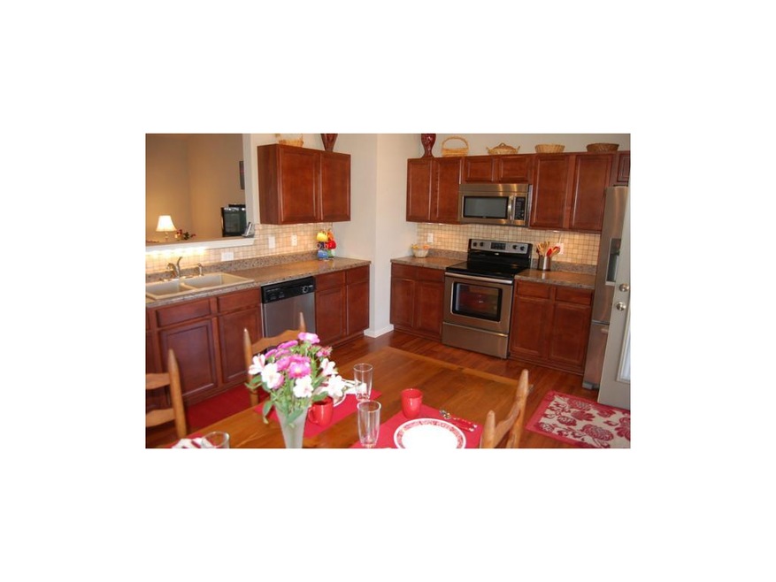 Stainless steel appliances and gorgeous cabinets!