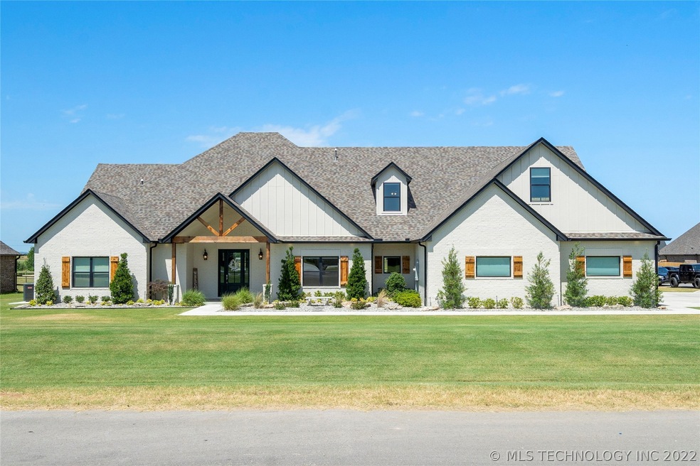 Builder's home on corner lot with three-car, side-