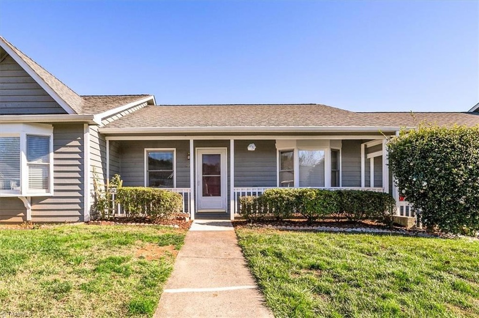 ONE LEVEL TOWNHOME! Greet your neighbors from the spacious Covered Front porch!