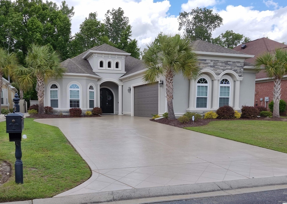 BEAUTIFUL ENTRANCE WITH STAINED DRIVEWAY