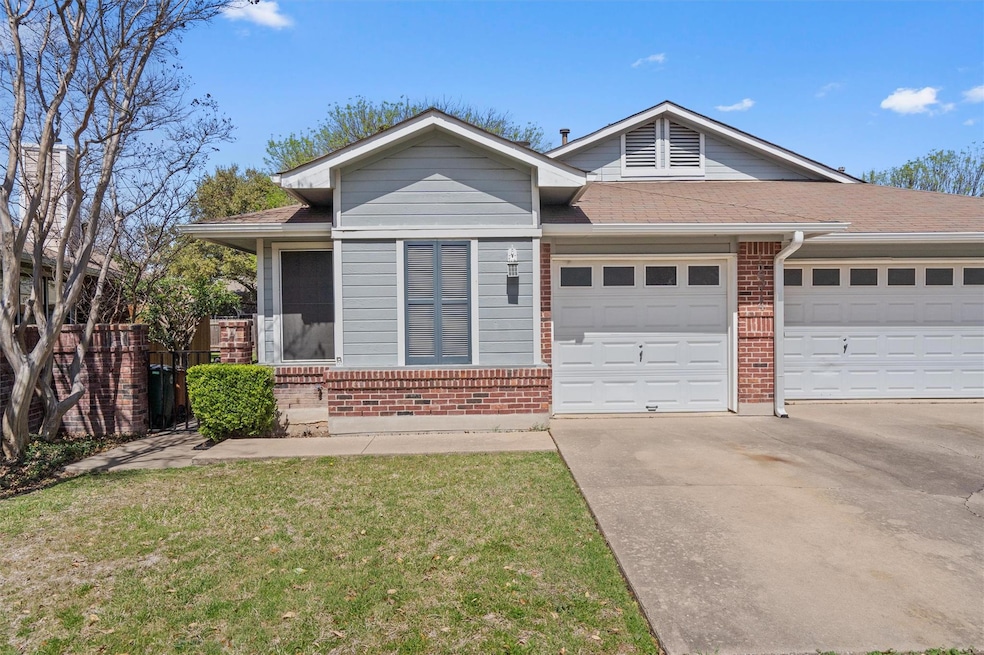 Ranch-style house featuring an attached garage, b