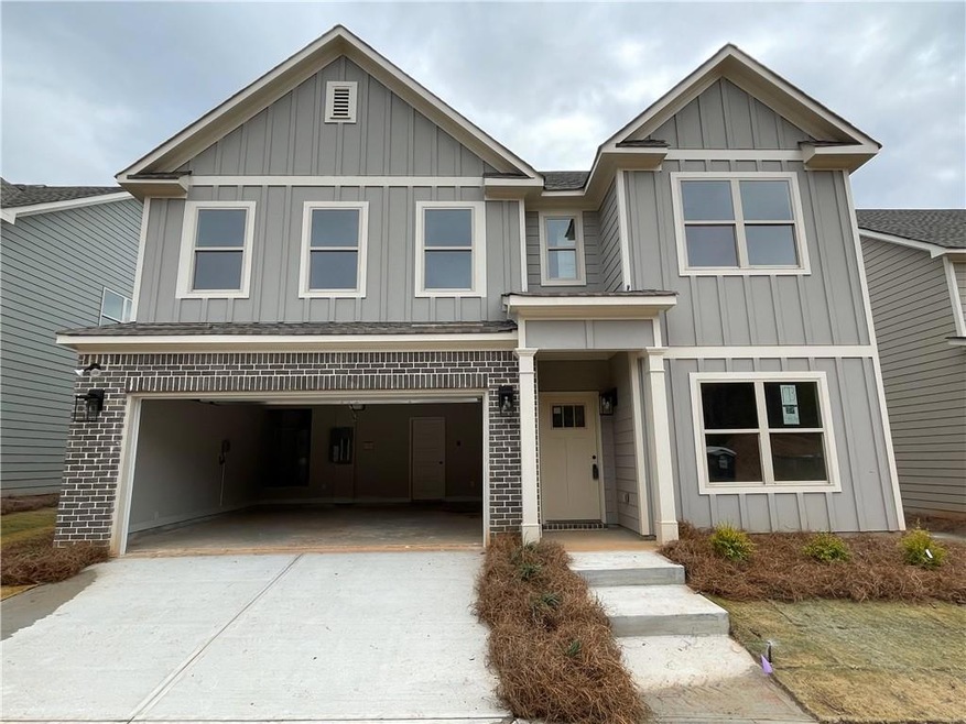 View of front facade featuring a garage