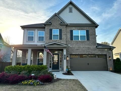 Craftsman inspired home featuring a garage