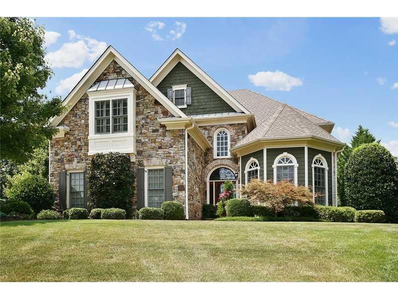 Exterior Front. Model home with pool and waterfall
