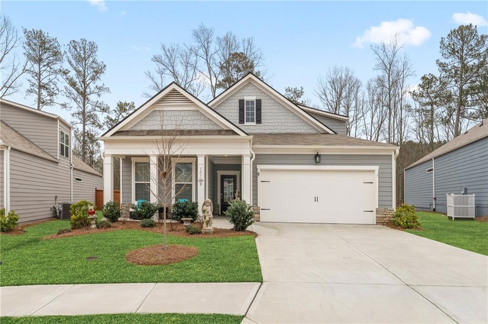 Craftsman-style home with covered porch, a garage,