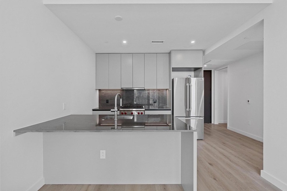 Kitchen with freestanding refrigerator, modern ca